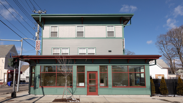 mixed-used development with ground-level windows and front door