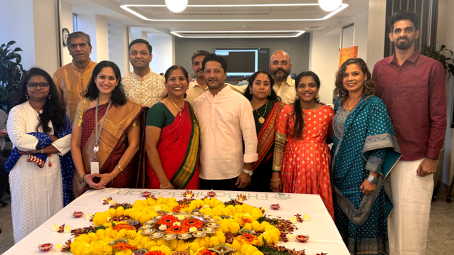 Twelve FHLBank Boston employees gather to celebrate Diwali.
